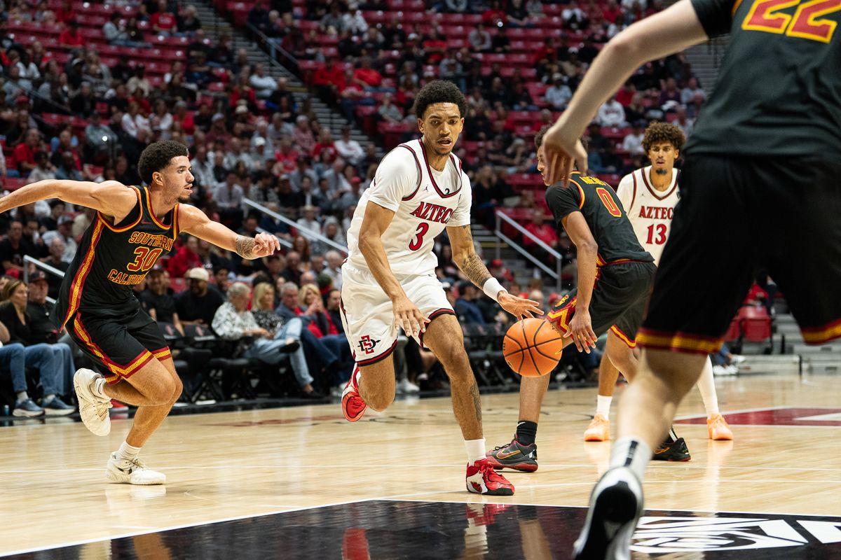San Diego State Aztecs guard Ezlie Harrington (3) advances the ball during the NCAA men’s basketball game against the University of Southern California Trojans, Friday, Oct. 23, 2026, at Viejas Arena in San Diego.