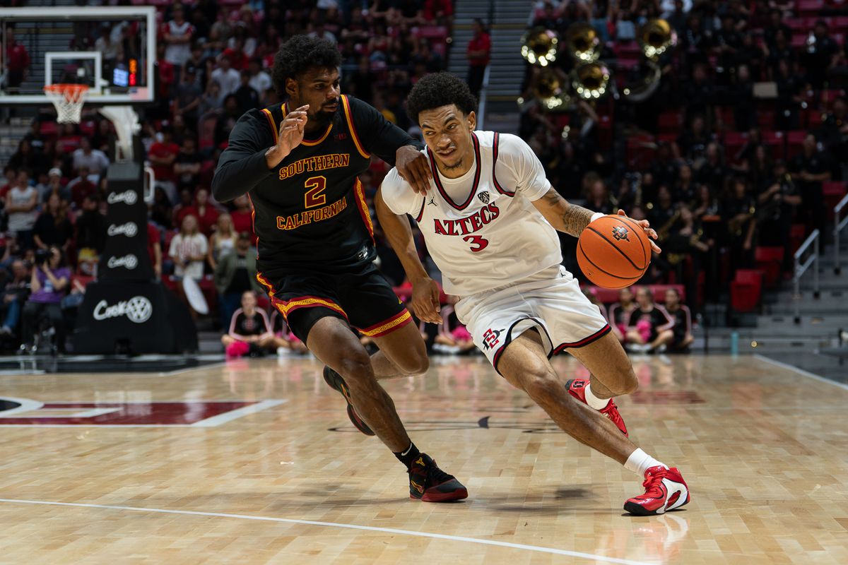 San Diego State Aztecs guard Ezlie Harrington (3) advances the ball during the NCAA men’s basketball game against the University of Southern California Trojans, Friday, Oct. 23, 2026, at Viejas Arena in San Diego.