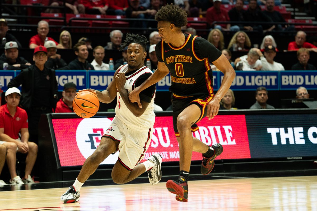 San Diego State Aztecs guard Latrell Davis (5) attacks the defense during the NCAA men’s basketball game against the University of Southern California Trojans, Friday, Oct. 23, 2026, at Viejas Arena in San Diego.