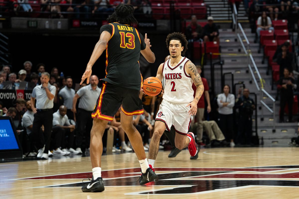 San Diego State Aztecs guard Chance Gladden (2) moves the ball up the court during the NCAA men’s basketball game against the University of Southern California Trojans, Friday, Oct. 23, 2026, at Viejas Arena in San Diego.