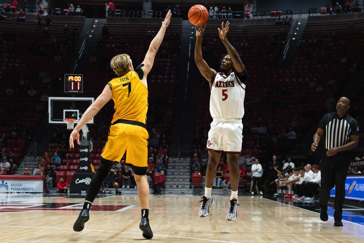 SDSU guard Latrell Davis (5) shoots a three during an NCAA basketball exhibition game against Long Beach State, Wednesday October 28, 2026 in San Diego, California. SDSU guard Latrell Davis (5) shoots a three during an NCAA basketball exhibition game against Long Beach State, Wednesday October 28, 2026 in San Diego, California.