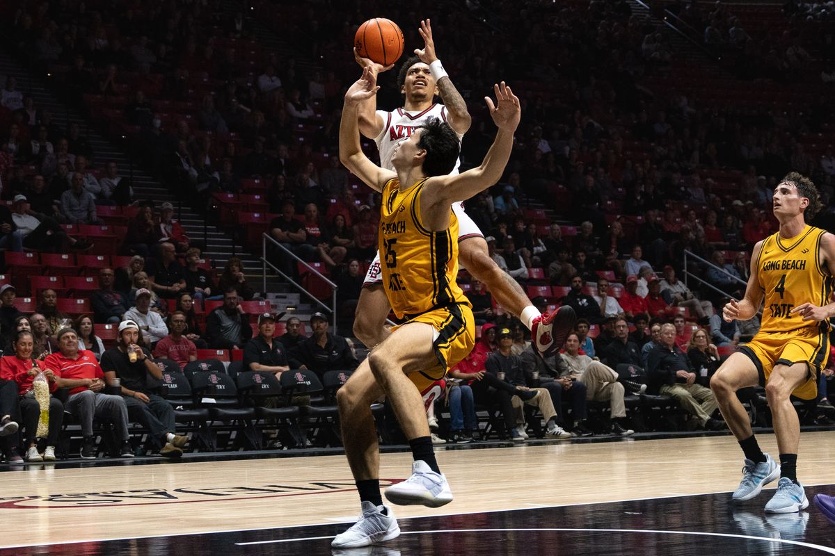 SDSU guard Elzie Harrington (3) shoots the ball during an NCAA basketball exhibition game against Long Beach State, Wednesday October 28, 2026 in San Diego, California. SDSU guard Elzie Harrington (3) shoots the ball during an NCAA basketball exhibition game against Long Beach State, Wednesday October 28, 2026 in San Diego, California.