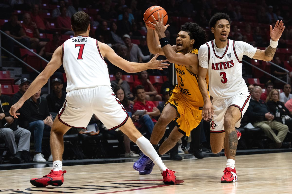 Long Beach State guard Yohann Sissoko (3) draws a foul during an NCAA basketball exhibition game against SDSU, Wednesday October 28, 2026 in San Diego, California. Long Beach State guard Yohann Sissoko (3) draws a foul during an NCAA basketball exhibition game against SDSU, Wednesday October 28, 2026 in San Diego, California.