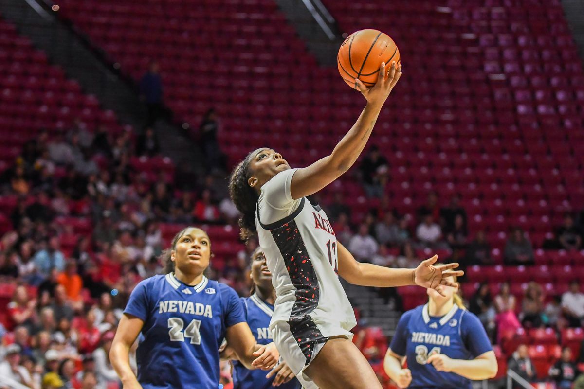 SDSU guard Kaelyn Hamilton (12) makes a driving layup during an NCAA basketball  game against Nevada Saturday January 31, 2026 in  San Diego, California.