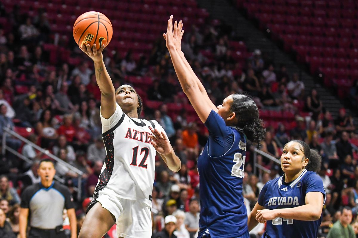 SDSU guard Kaelyn Hamilton (12) makes a running layup during an NCAA basketball  game against Nevada Saturday January 31, 2026 in  San Diego, California.