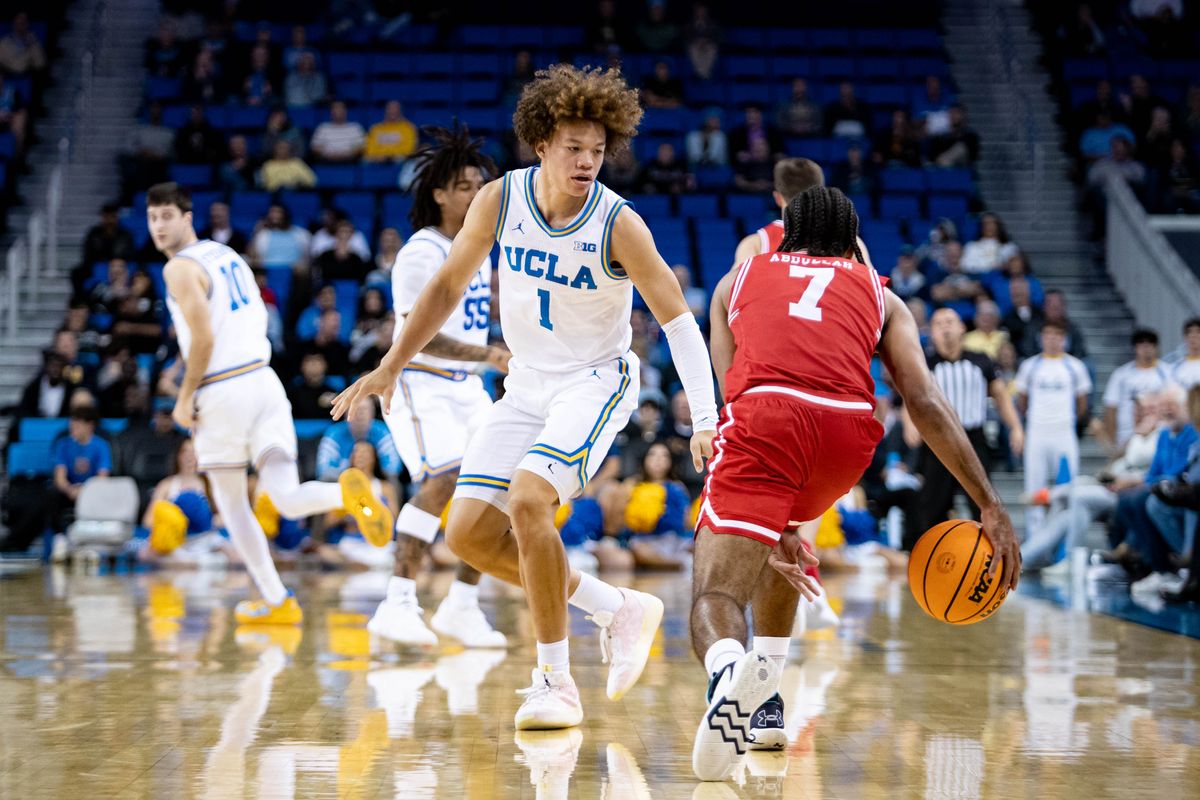 UCLA Bruins guard Trent Perry (1) guards Boston University Terriers guard Azmar Abdullah (7) during the 1st half of the game against Boston University Terriers on Monday, November 11th, 2024, at Pauley Pavilion in Los Angeles, CA.