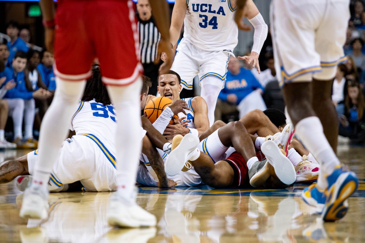 UCLA Bruins fight for the ball on the ground during the 1st half of the game against Boston University Terriers on Monday, November 11th, 2024, at Pauley Pavilion in Los Angeles, CA.