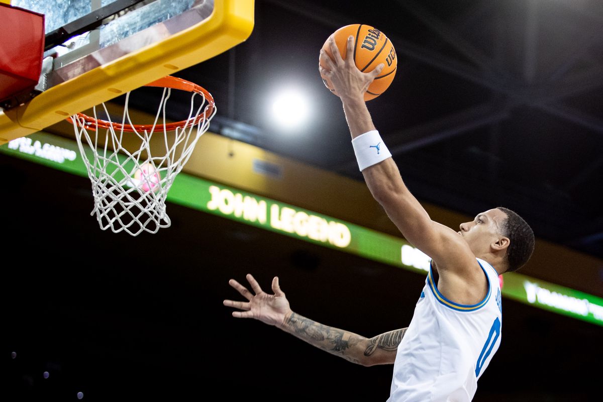 UCLA Bruins guard Kobe Johnson (0) dunks the ball to secure 2 points for the UCLA Bruins during the 1st half of the game against Boston University Terriers on Monday, November 11th, 2024, at Pauley Pavilion in Los Angeles, CA.