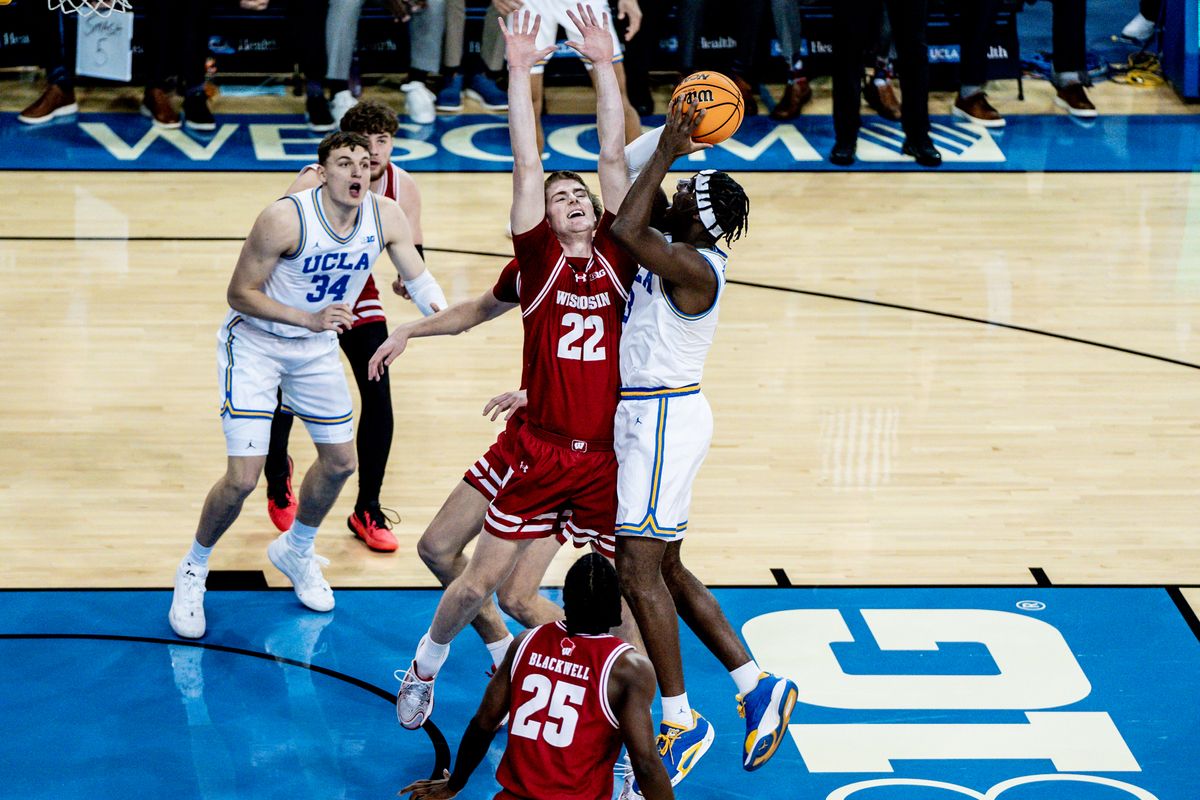 UCLA Bruins G Eric Daily JR (3) attacks the defender for two points in the game against Wisconsin on Tuesday, January 21, 2025, at Pauley Pavilion in Los Angeles, CA.