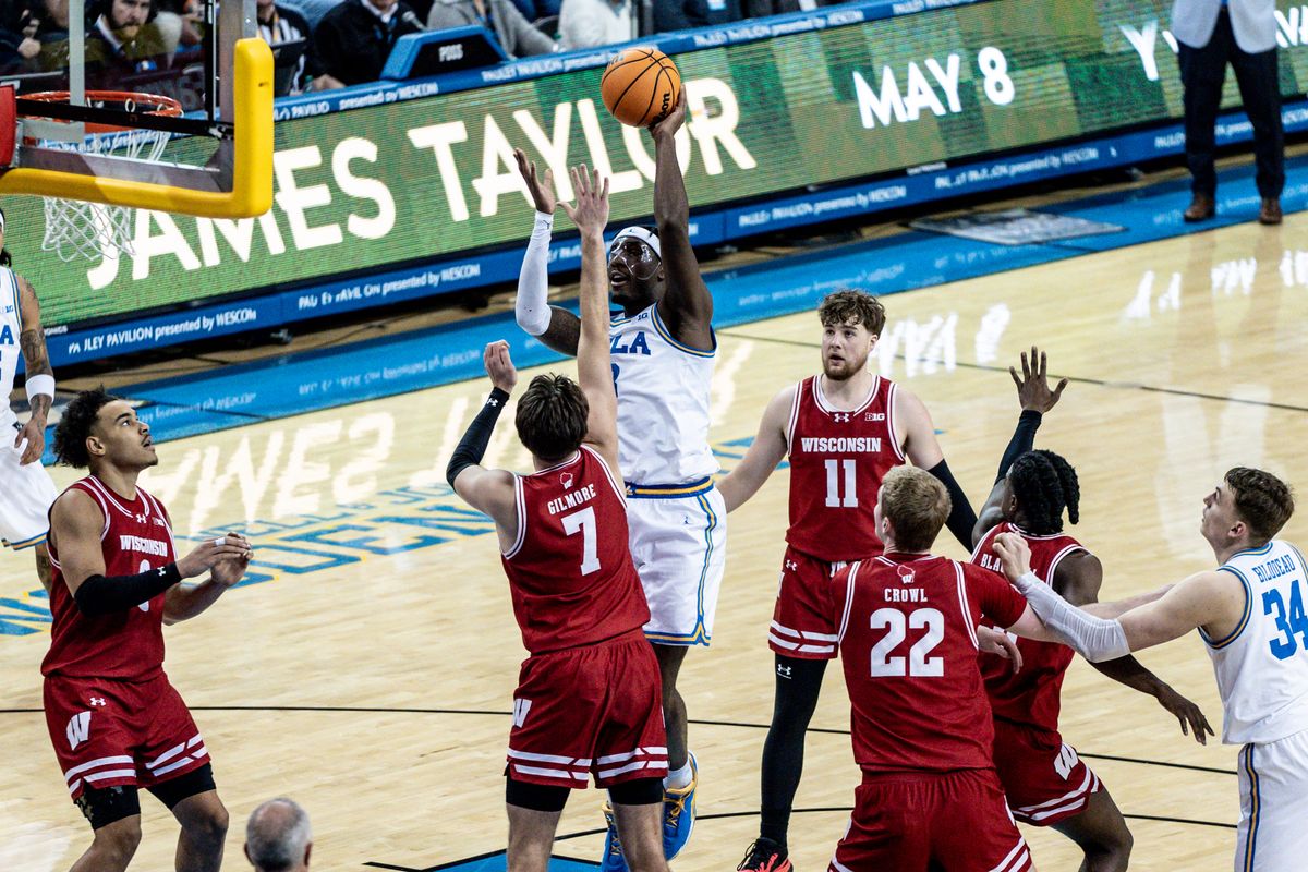 UCLA Bruins G Eric Daily JR (3) shoots a floater over the defender in the game against Wisconsin on Tuesday, January 21, 2025, at Pauley Pavilion in Los Angeles, CA.