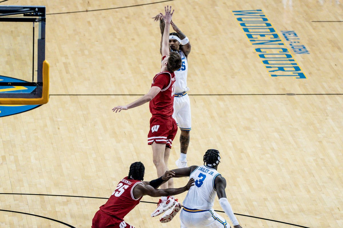 UCLA Bruins G Skyy Clark (55) shoots a three pointer over the defender in the game against Wisconsin on Tuesday, January 21, 2025, at Pauley Pavilion in Los Angeles, CA.