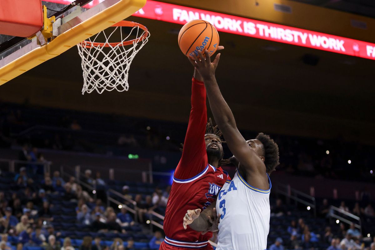 Forward Kenneth Chime #22 of the West Georgia Wolves blocks a shot by forward Eric Dailey Jr. #3 of the UCLA Bruins during an NCAA basketball game, Monday November 10, 2025 in Los Angeles, Calif. Forward Kenneth Chime #22 of the West Georgia Wolves blocks a shot by forward Eric Dailey Jr. #3 of the UCLA Bruins during an NCAA basketball game, Monday November 10, 2025 in Los Angeles, Calif.