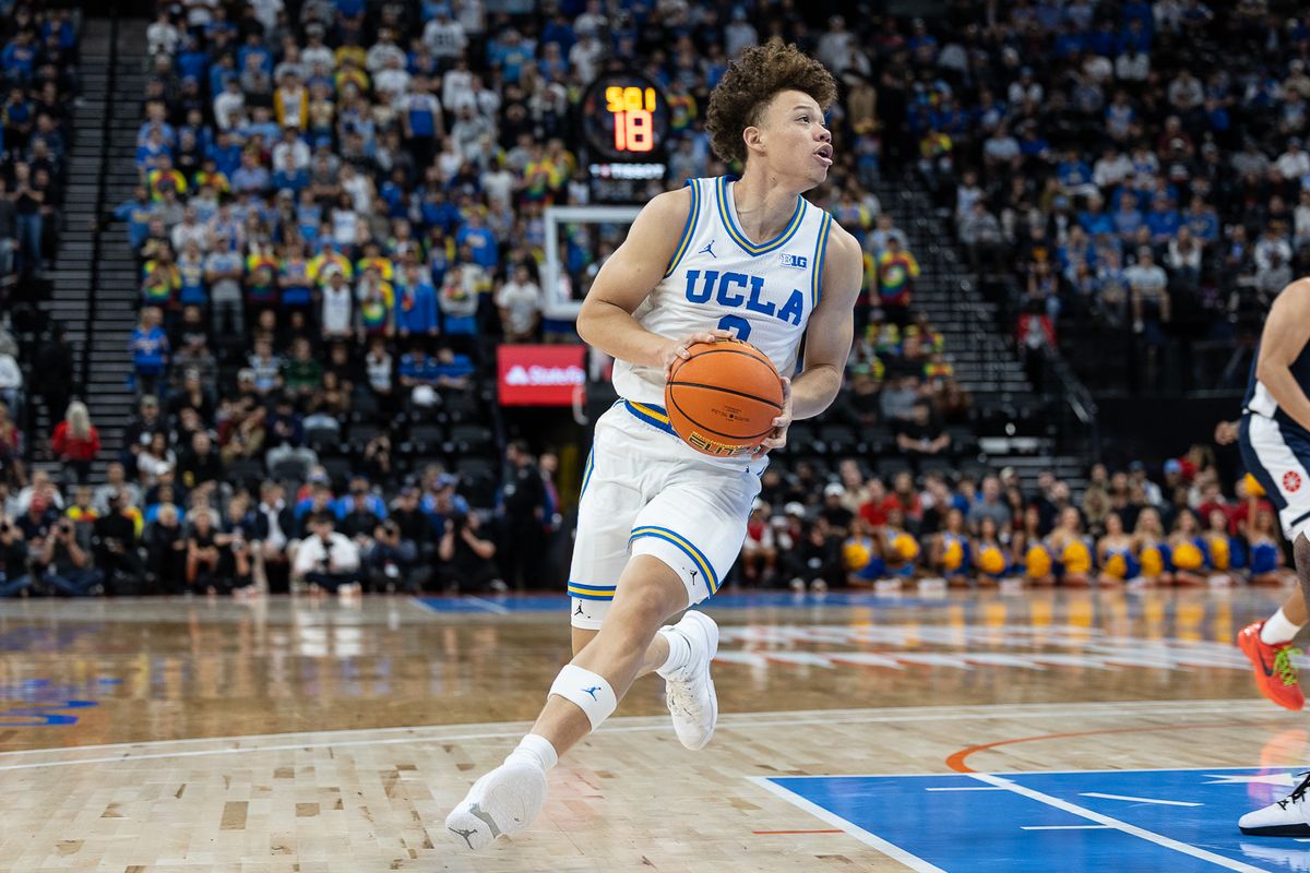 UCLA guard Trent Perry (0) dribbles during a Big Ten Conference college basketball game against the Arizona Wildcats, Friday November 14, 2025 in Inglewood, Calif.