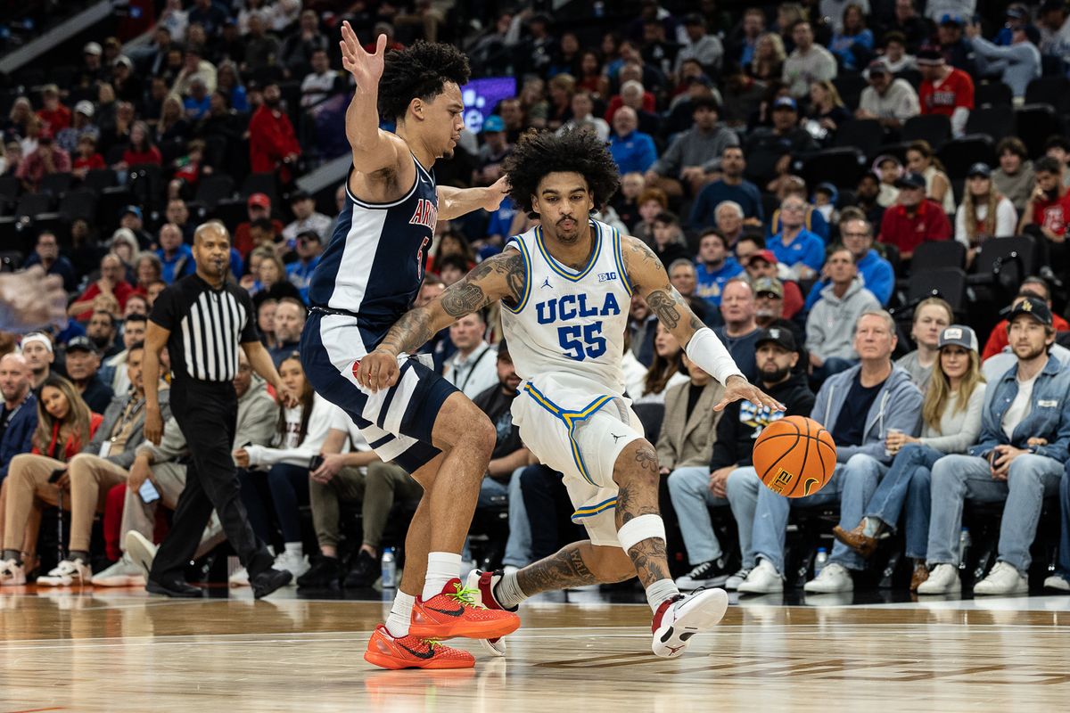 UCLA guard Skyy Clark (55) dribbles during a Big Ten Conference college basketball game against the Arizona Wildcats, Friday November 14, 2025 in Inglewood, Calif.