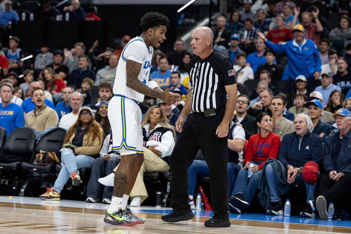 UCLA guard Donovan Dent (2) talks to the ref during a Big Ten Conference college basketball game against the Arizona Wildcats, Friday November 14, 2025 in Inglewood, Calif.