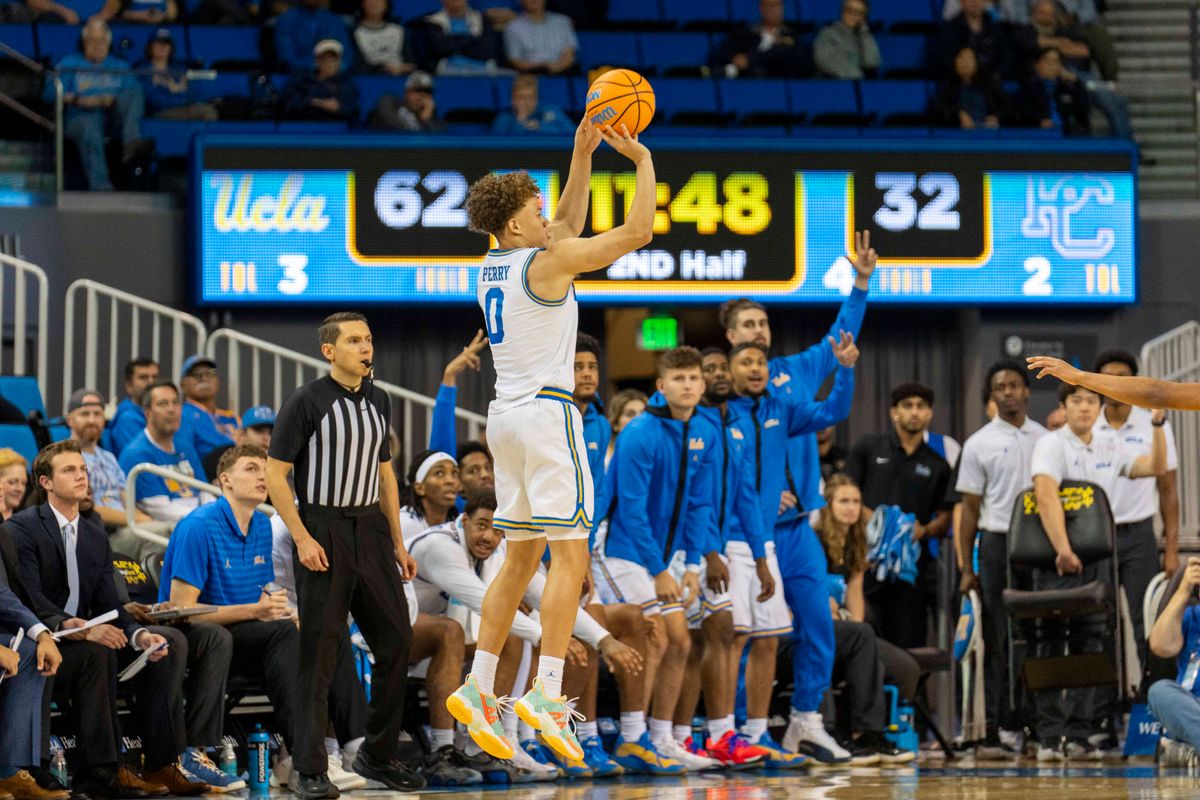 UCLA guard Trent Perry (0) makes a three during an NCAA basketball game against Presbyterian, Friday November 21st, 2025 in Los Angeles, California. 