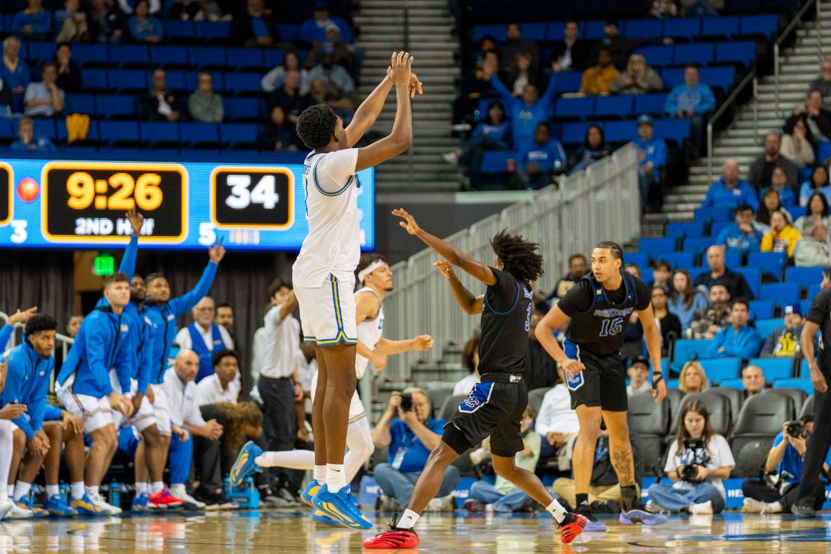 UCLA forward Xavier Booker (1) makes a three during an NCAA basketball game against Presbyterian, Friday November 21st, 2025 in Los Angeles, California. 