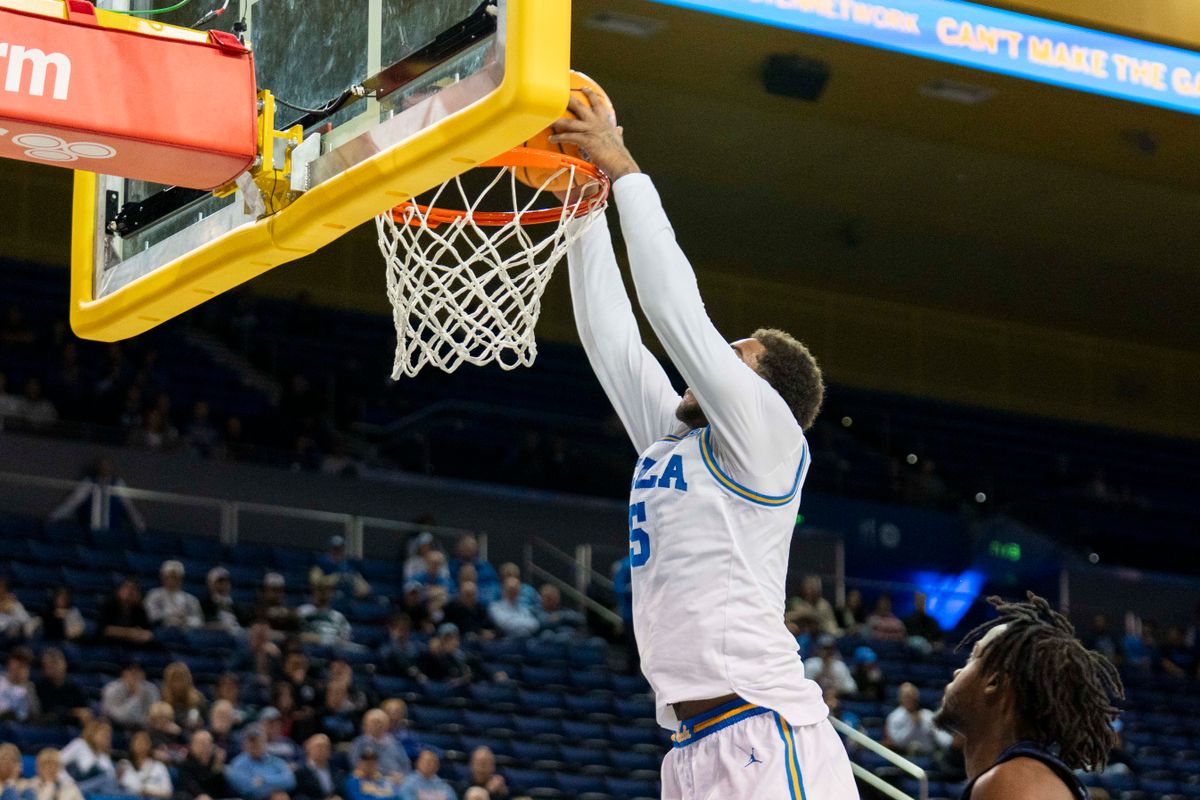 UCLA guard Brandon Williams (5) gets a dunk during an NCAA basketball game against Presbyterian, Friday November 21st, 2025 in Los Angeles, California. 
