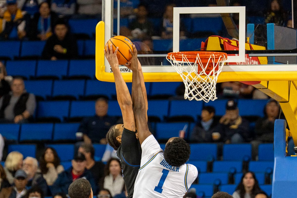 UCLA forward Xavier Booker (1) blocks a dunk attempt during an NCAA basketball game against Presbyterian, Friday November 21st, 2025 in Los Angeles, California. 