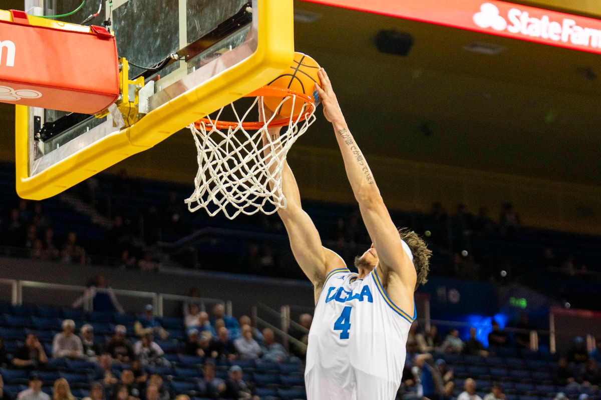 UCLA guard Jamar Brown (4) gets a fast break dunk during an NCAA basketball game against Presbyterian, Friday November 21st, 2025 in Los Angeles, California. 