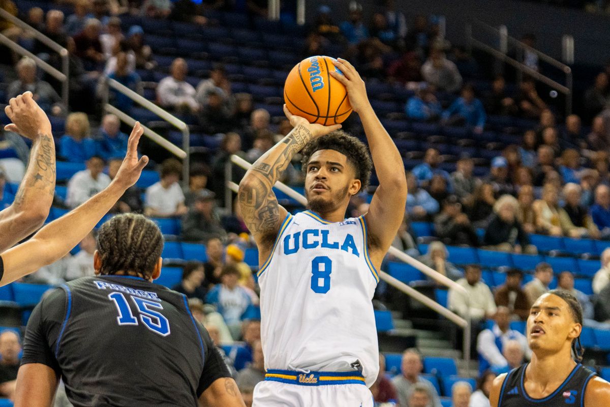 UCLA guard Eric Freeny (8) makes a jumper during an NCAA basketball game against Presbyterian, Friday November 21st, 2025 in Los Angeles, California. 