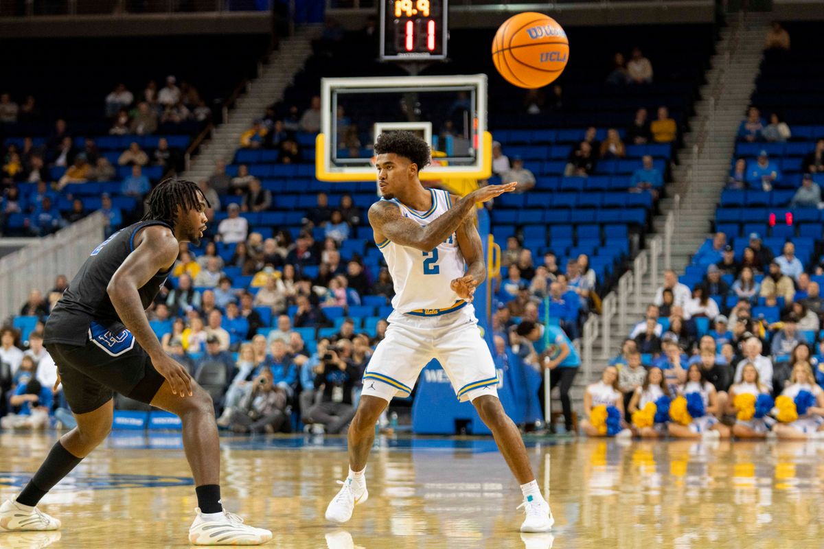 UCLA guard Donovan Dent (2) with a no look pass during an NCAA basketball game against Presbyterian, Friday November 21st, 2025 in Los Angeles, California. 