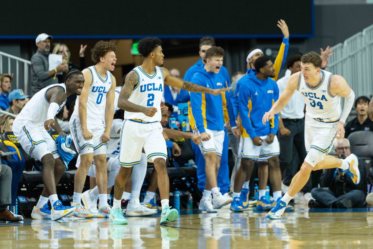 UCLA bench celebrates a made shot by forward Tyler Bilodeau (34) during a Big 10 basketball game against the University of Oregon, Saturday, December 6th, 2025 in Los Angeles, California