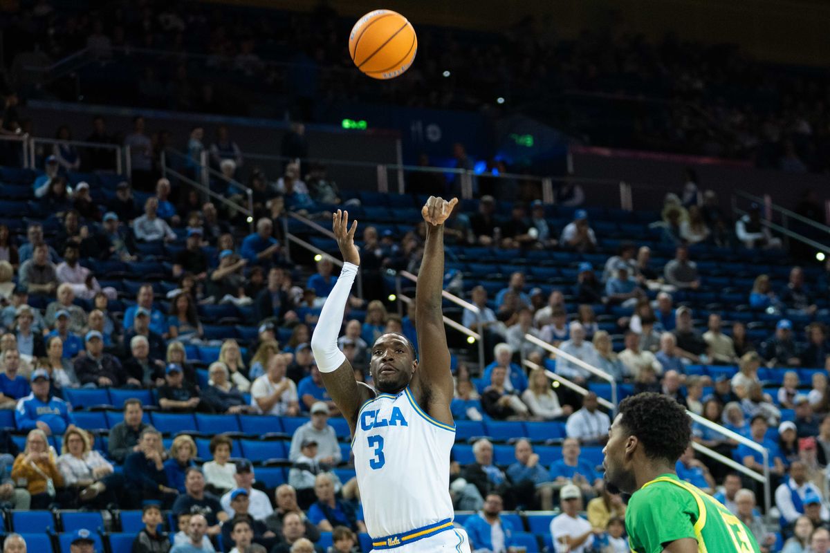 UCLA guard Eric Daily Jr. (3) takes a three-pointer during a Big 10 basketball game against the University of Oregon, Saturday, December 6th, 2025 in Los Angeles, California