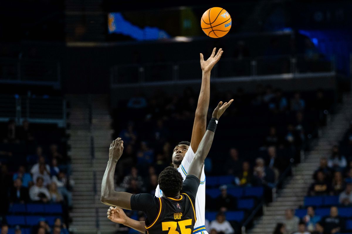 UCLA center Xavier Booker (1) tips off to start a Big 10 basketball game against ASU, Wednesday, December 17th, 2025 in Los Angeles, California