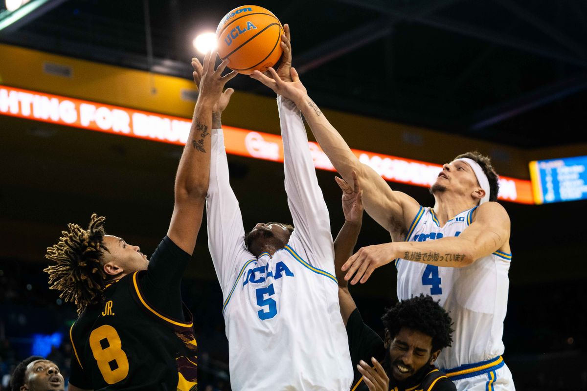 UCLA guard Brandon Williams (5) fights for possession during a Big 10 basketball game against ASU, Wednesday, December 17th, 2025 in Los Angeles, California