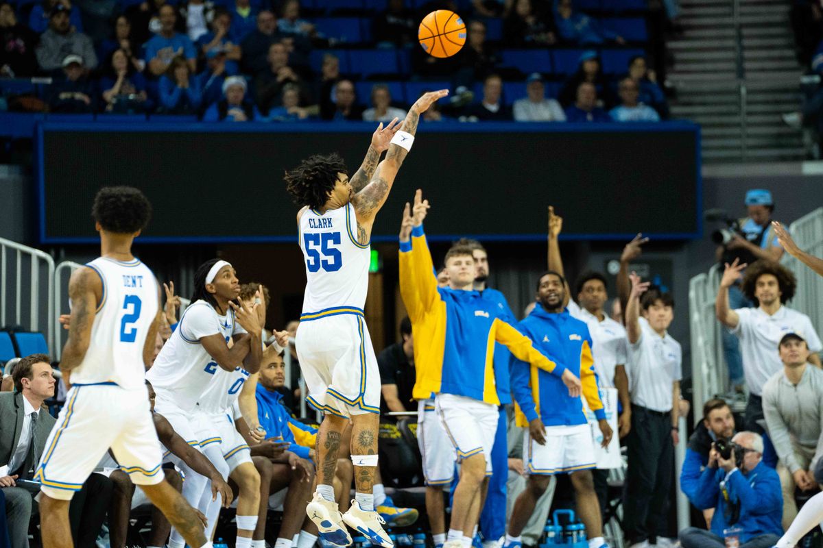 UCLA guard Skyy Clark (55) shoots a three-pointer during a Big 10 basketball game against ASU, Wednesday, December 17th, 2025 in Los Angeles, California