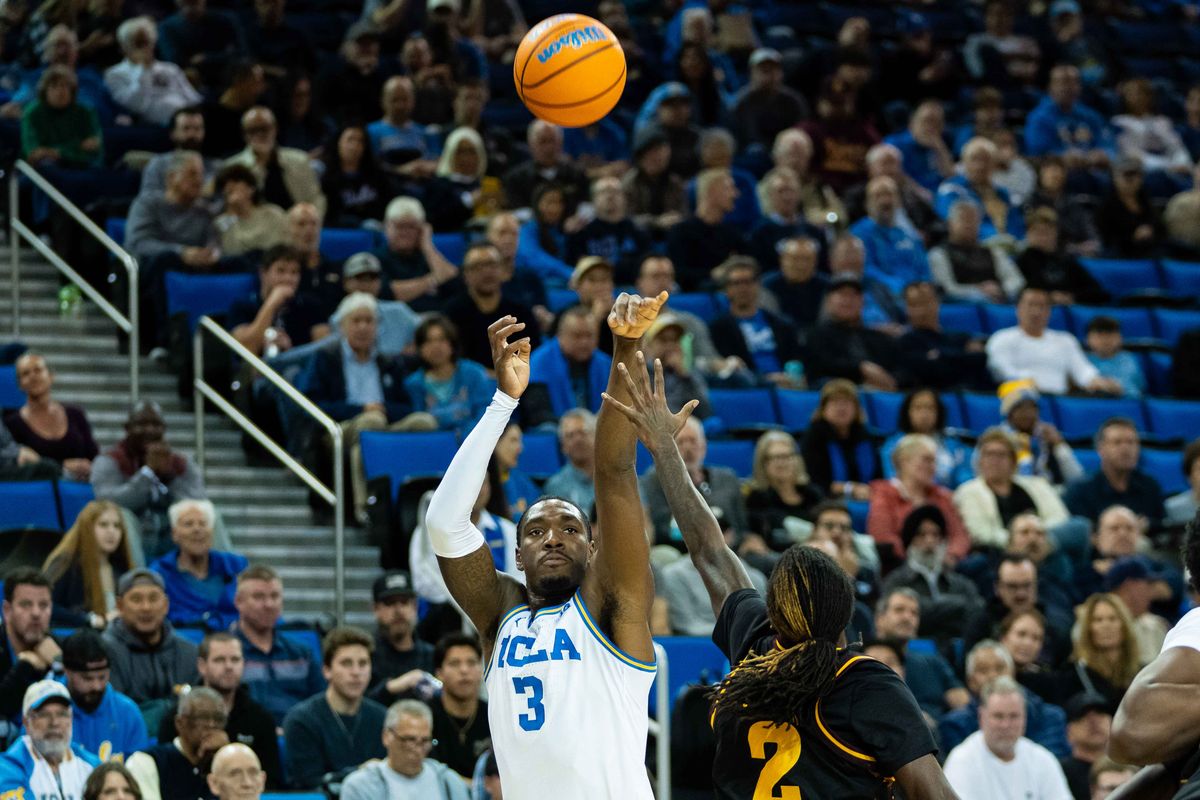UCLA guard Eric Daily Jr. (3) shoots a three-pointer during a Big 10 basketball game against ASU, Wednesday, December 17th, 2025 in Los Angeles, California