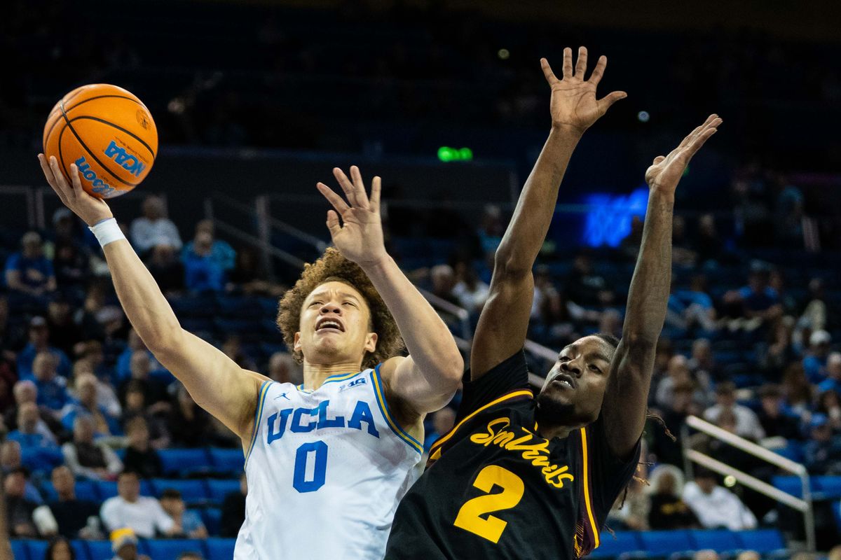 UCLA guard Trent Perry (0) shoots a lay-up during a Big 10 basketball game against ASU, Wednesday, December 17th, 2025 in Los Angeles, California