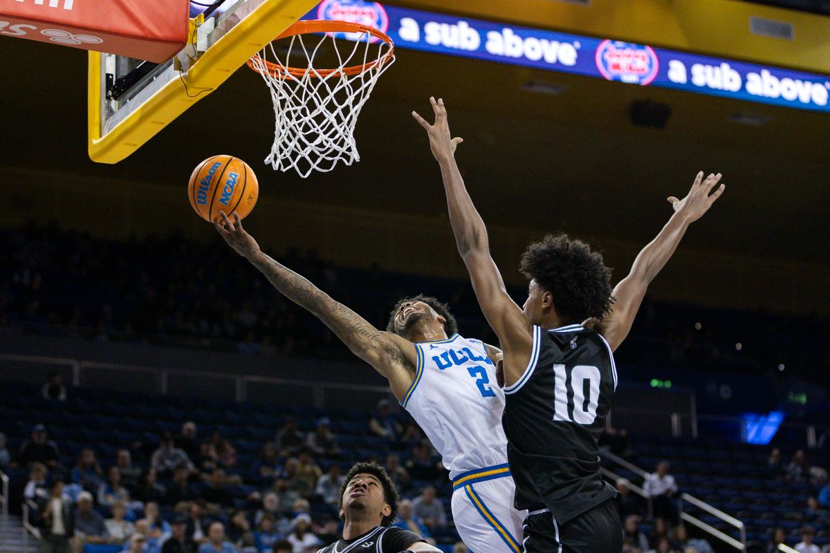 Donovan Dent #2 of the UCLA Bruins lays the ball up during an NCAA basketball game against the Cal Poly Mustangs, Friday December 19, 2025 in Los Angeles, Calif.
