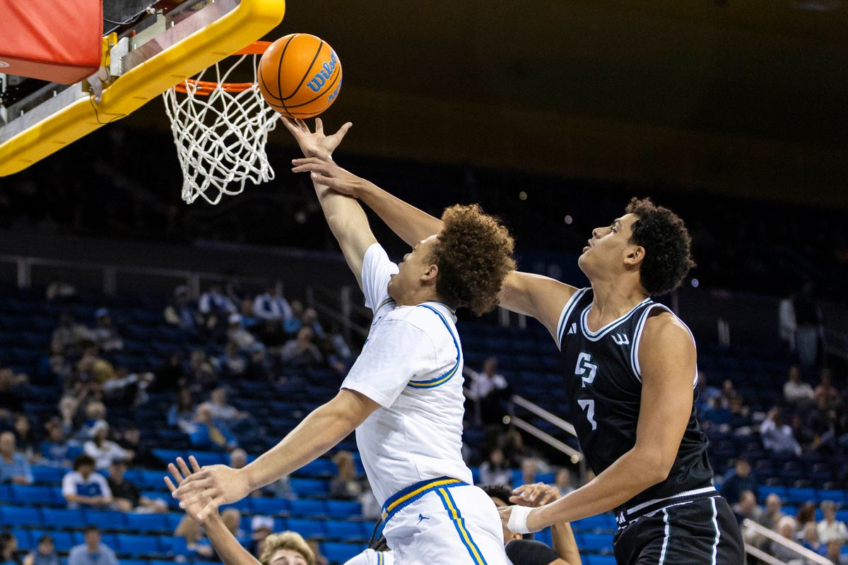 Trent Perry #0 of the UCLA Bruins lays the ball up during an NCAA basketball game against the Cal Poly Mustangs, Friday December 19, 2025 in Los Angeles, Calif.