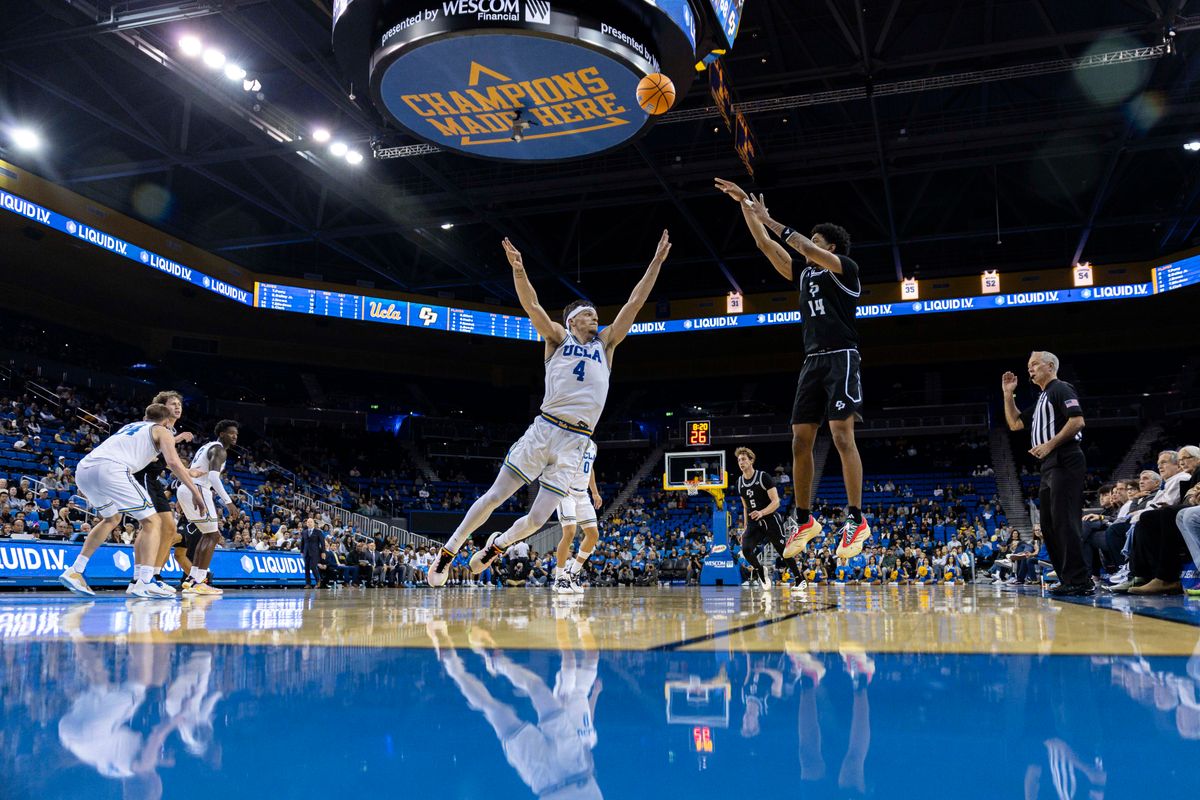 Cayden Ward #14 of the Cal Poly Mustangs shoots the ball during an NCAA basketball game against the UCLA Bruins, Friday December 19, 2025 in Los Angeles, Calif.