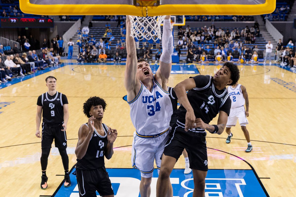 Tyler Bilodeau #34 of the UCLA Bruins dunks the ball during an NCAA basketball game against the Cal Poly Mustangs, Friday December 19, 2025 in Los Angeles, Calif.