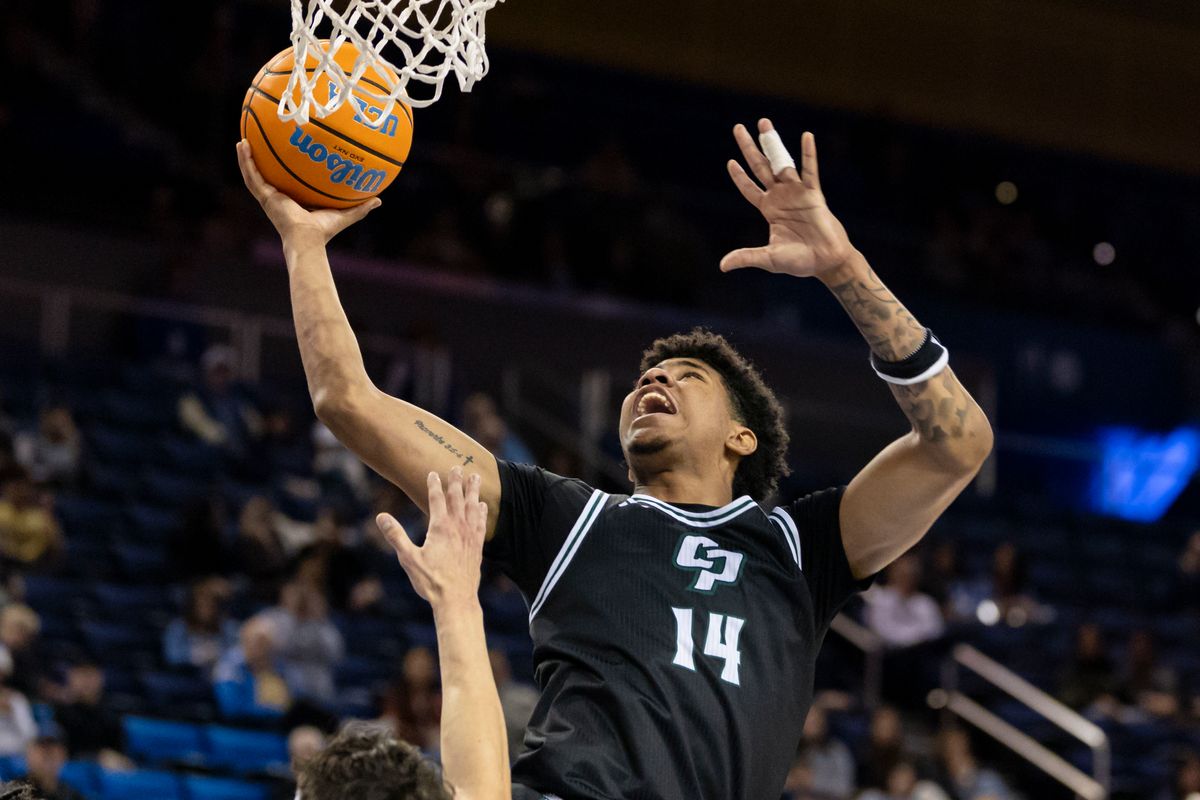 Cayden Ward #14 of the Cal Poly Mustangs lays the ball up during an NCAA basketball game against the UCLA Bruins, Friday December 19, 2025 in Los Angeles, Calif.