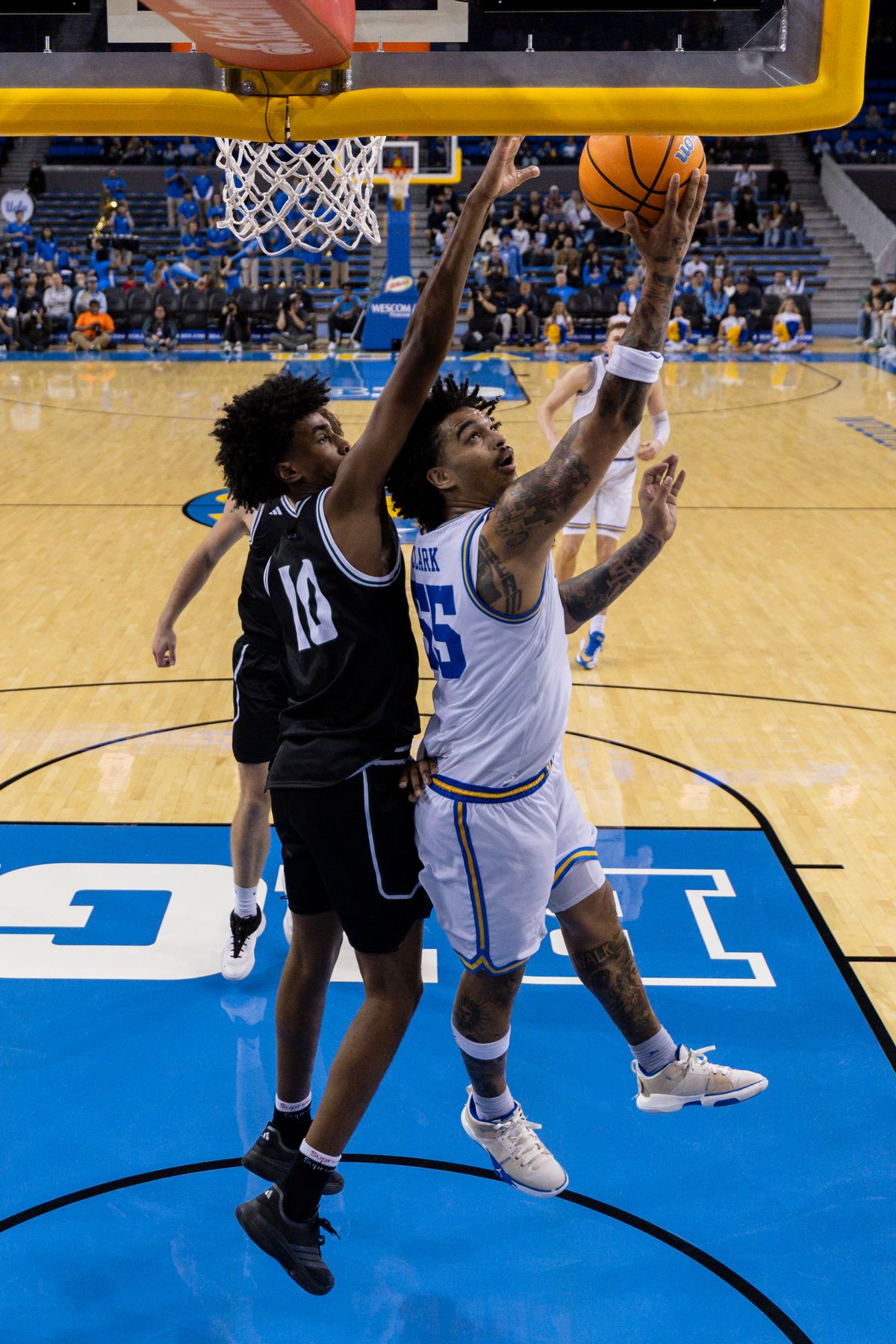 Skyy Clark #55 of the UCLA Bruins lays the ball up during an NCAA basketball game against the Cal Poly Mustangs, Friday December 19, 2025 in Los Angeles, Calif.