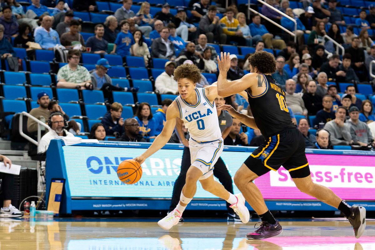 UCLA guard Trent Perry (0) drives past the defense during an NCAA basketball game against UC Riverside, Tuesday December 23rd, 2025 in Los Angeles, California. 
