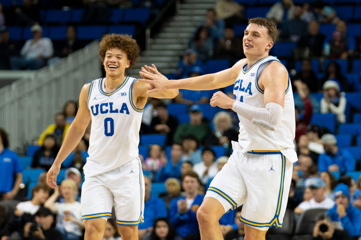 UCLA forward Tyler Bilodeau (34) celebrates his made three with Tyler Perry (0) during an NCAA basketball game against UC Riverside, Tuesday December 23rd, 2025 in Los Angeles, California.