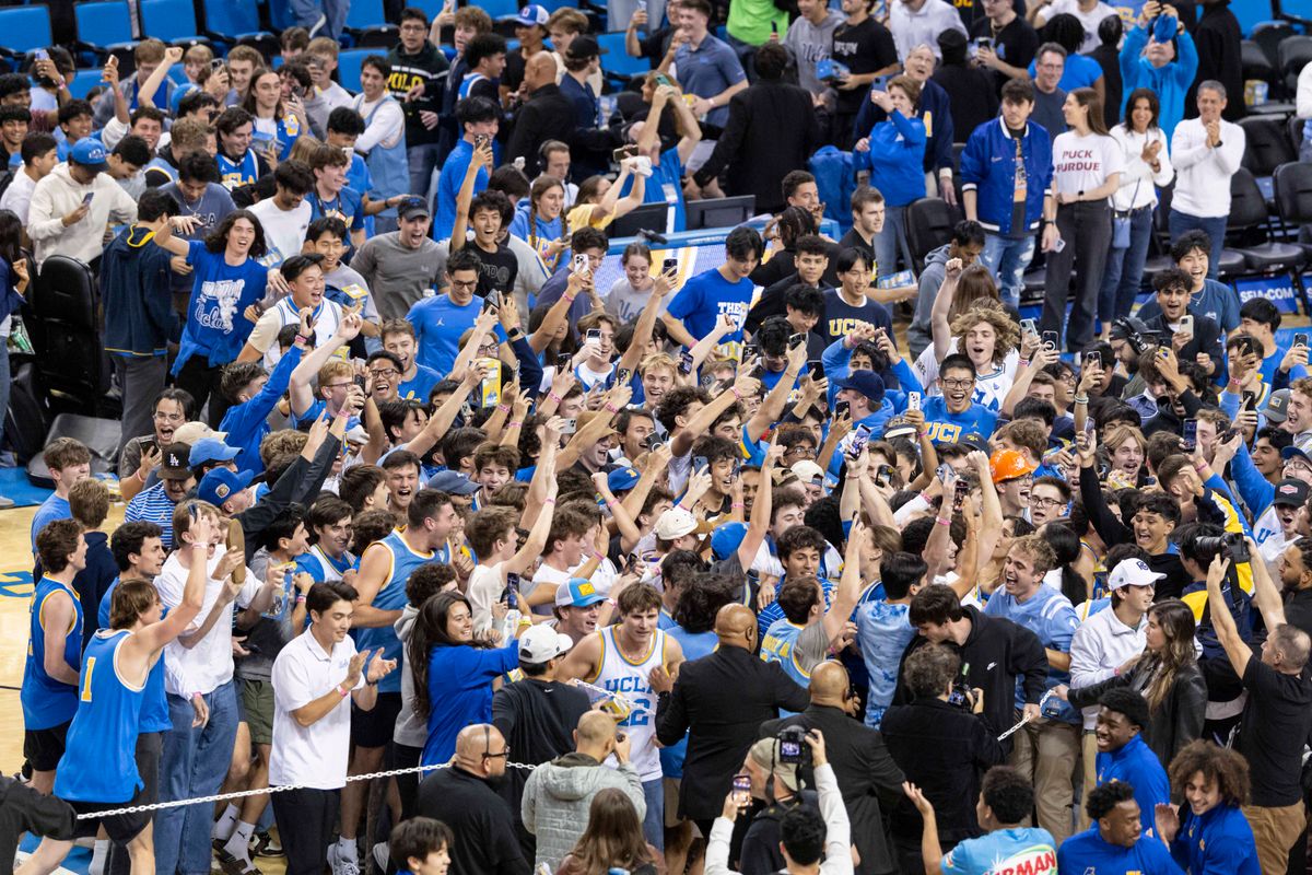 UCLA students storm the court after the UCLA Bruins upset the Purdue Boilermakers at Pauley Pavilion, Tuesday January 20, 2026 in Los Angeles, Calif.