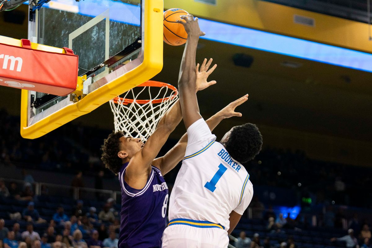 UCLA forward Xavier Booker (1) gets fouled on a dunk attempt during an NCAA basketball game against Northwestern, Saturday January 24th, 2026 in Los Angeles, California. 