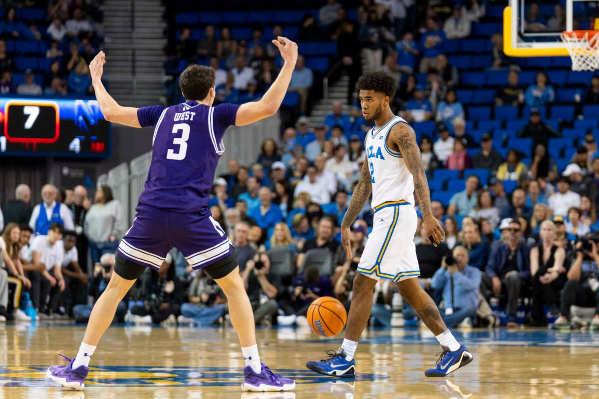 UCLA guard Donovan Dent (2) slows down the offense during an NCAA basketball game against Northwestern, Saturday January 24th, 2026 in Los Angeles, California. 