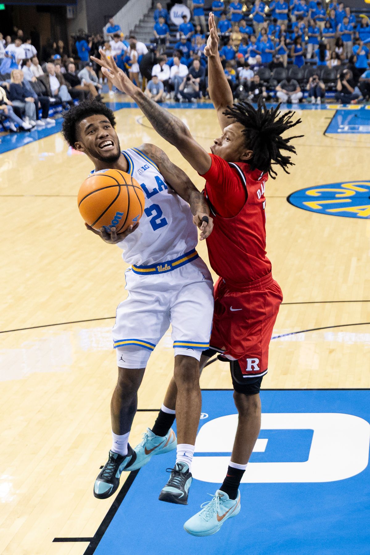 Donovan Dent #2 of the UCLA Bruins lays the ball up during an NCAA basketball game against the Rutgers Scarlet Knights, Tuesday February 3, 2026 in Los Angeles, Calif.