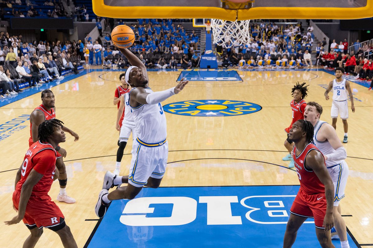 Eric Dailey Jr. #3 of the UCLA Bruins takes off for a dunk during an NCAA basketball game against the Rutgers Scarlet Knights, Tuesday February 3, 2026 in Los Angeles, Calif.