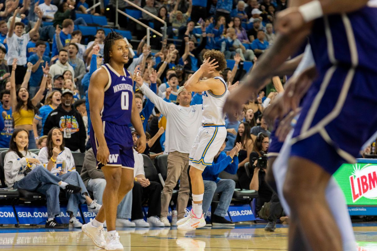 UCLA guard Trent Perry (0) celebrates with the crowd after hitting a three during an NCAA basketball game against Washington, Saturday February 7th, 2026 in Los Angeles, California. 