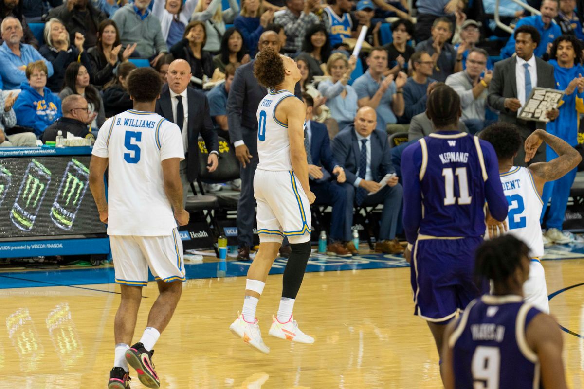 UCLA guard Trent Perry (0) celebrates after hitting a three during an NCAA basketball game against Washington, Saturday February 7th, 2026 in Los Angeles, California. 