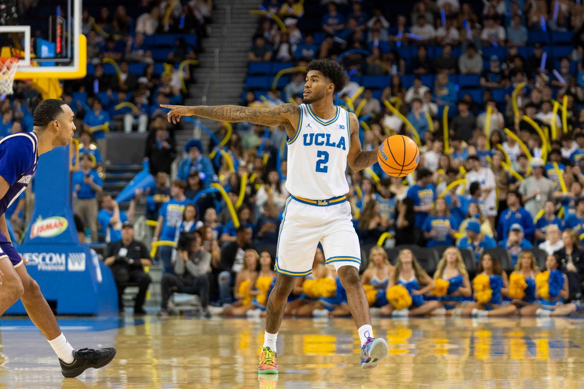 UCLA guard Donovan Dent (2) sets up the offense during an NCAA basketball game against Washington, Saturday February 7th, 2026 in Los Angeles, California. 