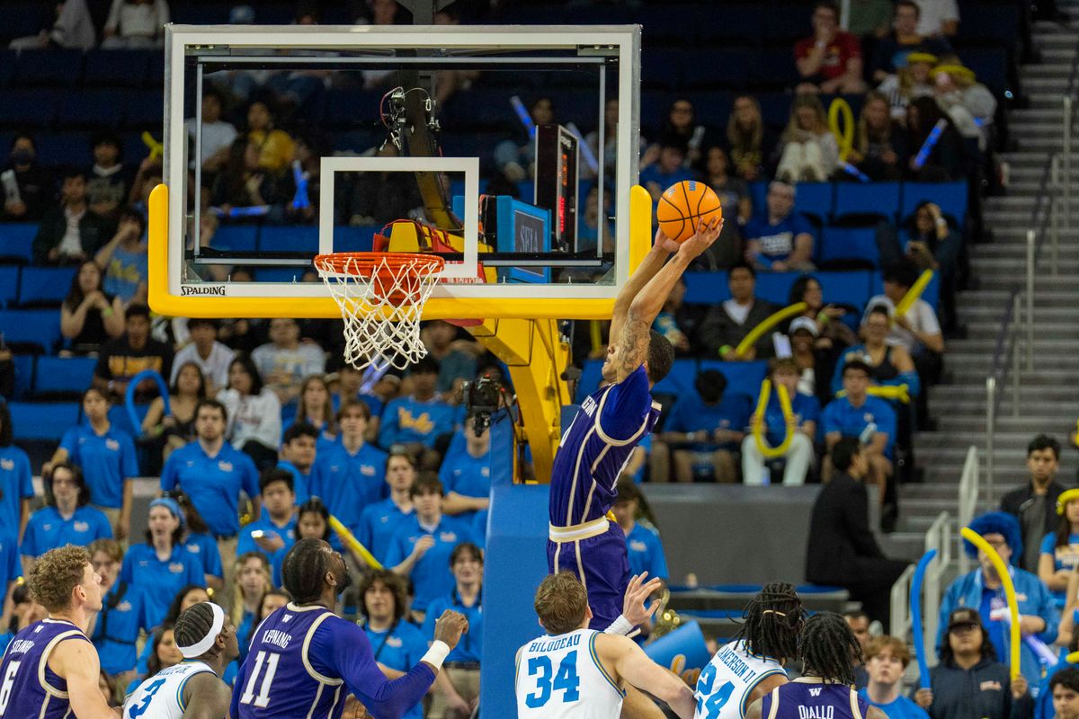 Washington forward Bryson Tucker (8) finishes the lob during an NCAA basketball game against UCLA, Saturday February 7th, 2026 in Los Angeles, California. 